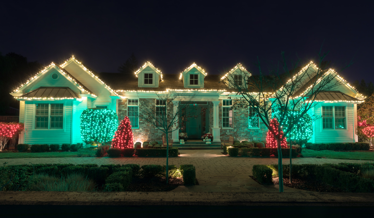 Permanent holiday lighting Summerfield NC on a modern home exterior at night